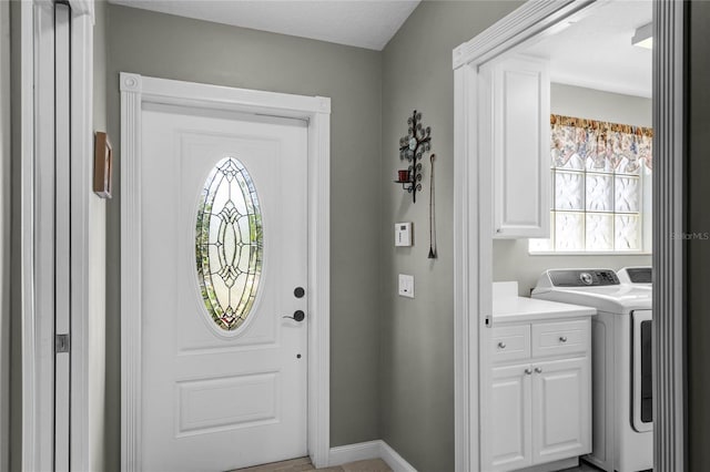 entryway with plenty of natural light and independent washer and dryer