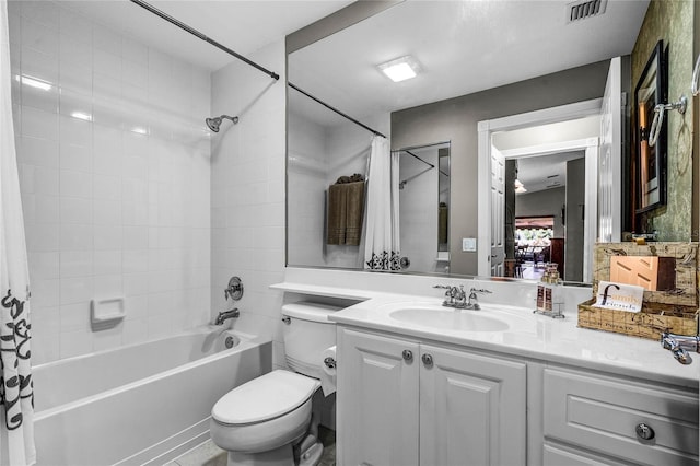 full bathroom with vanity, shower / tub combo with curtain, and toilet