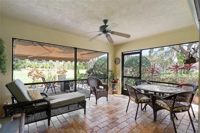 sunroom / solarium with ceiling fan