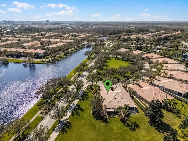 birds eye view of property with a water view