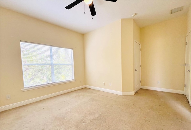 carpeted empty room with ceiling fan