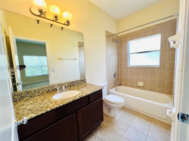 full bathroom with vanity, toilet, tiled shower / bath combo, and tile patterned flooring