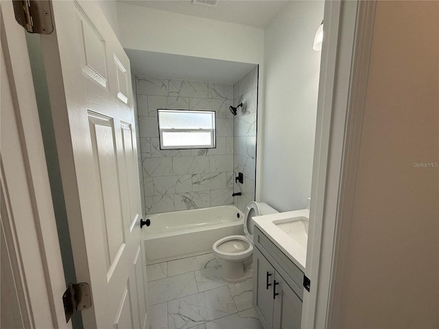 full bathroom featuring vanity, toilet, and tiled shower / bath combo