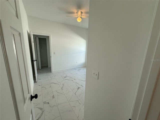 unfurnished room featuring ceiling fan