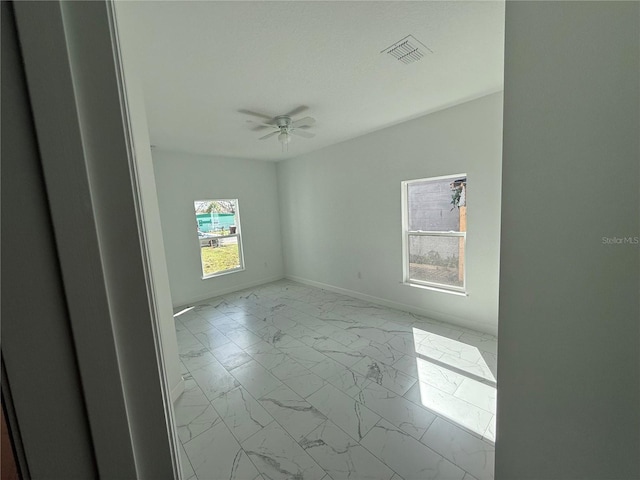 empty room featuring ceiling fan