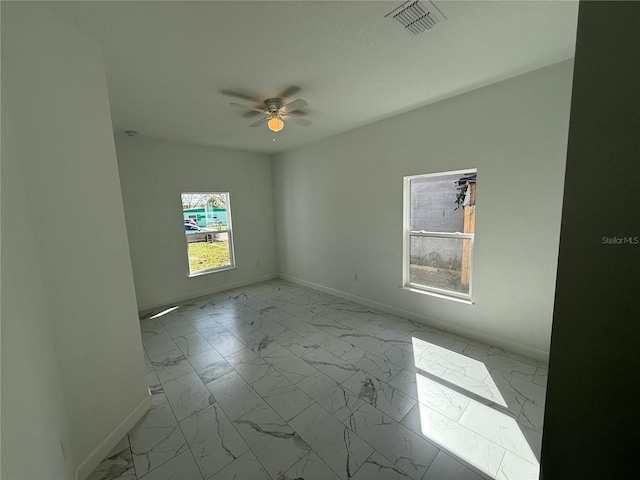 empty room featuring ceiling fan