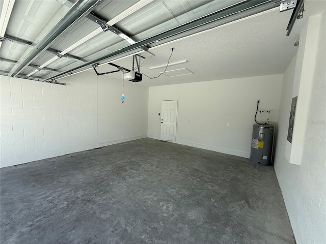 garage featuring a garage door opener and electric water heater