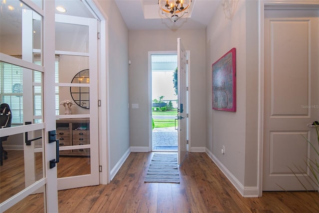 foyer with french doors and hardwood / wood-style floors