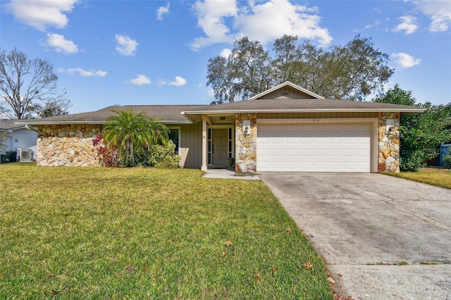 ranch-style house featuring a garage and a front yard