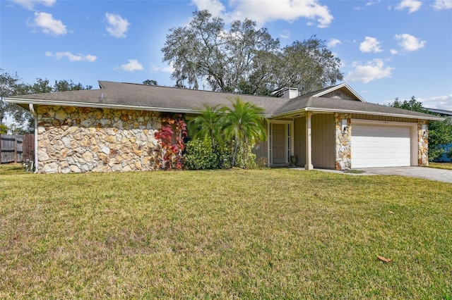 single story home with a garage and a front lawn