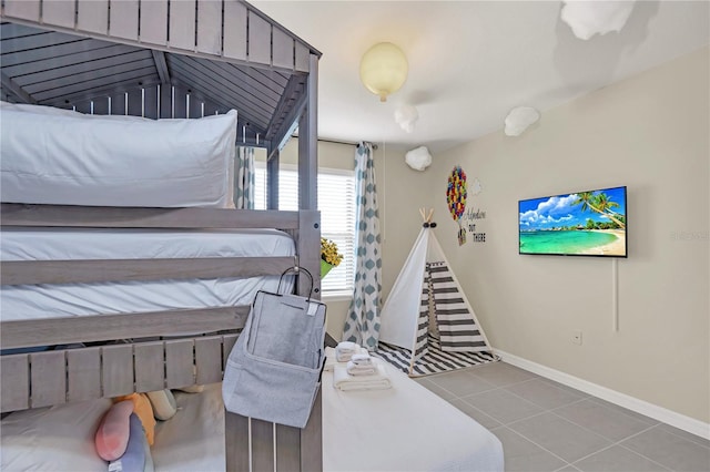 bedroom with light tile patterned floors