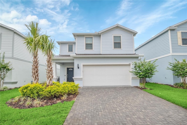 front facade with a garage and a front yard