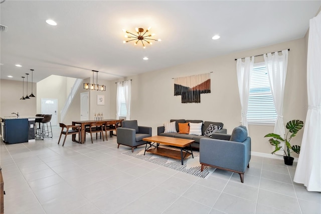 tiled living room with an inviting chandelier and sink