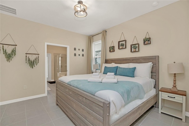 tiled bedroom featuring connected bathroom