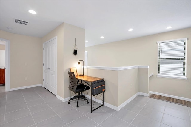 home office with light tile patterned floors