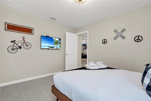 bedroom featuring light tile patterned floors