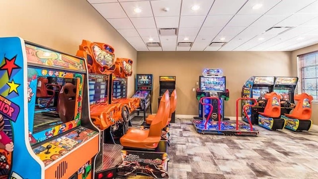 recreation room with a drop ceiling