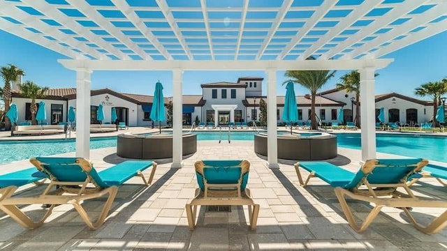 view of pool with a patio and a pergola