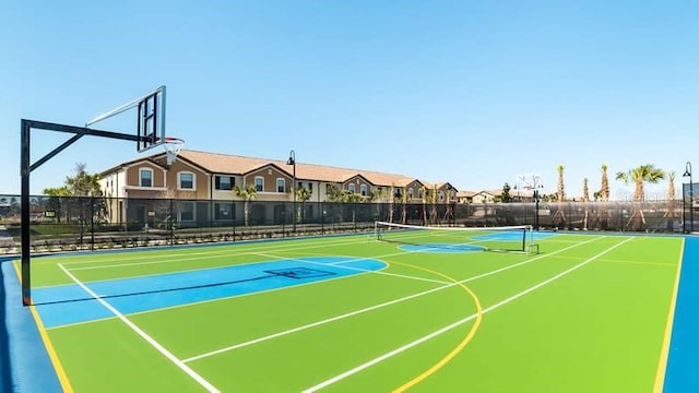 view of basketball court featuring tennis court