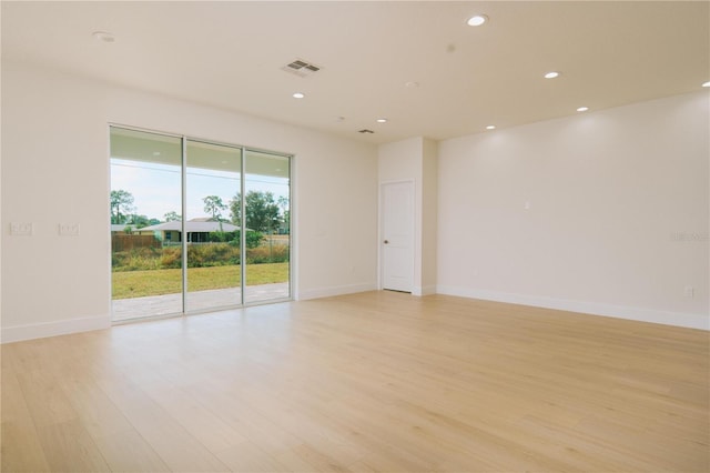 unfurnished room with recessed lighting, visible vents, baseboards, and light wood finished floors