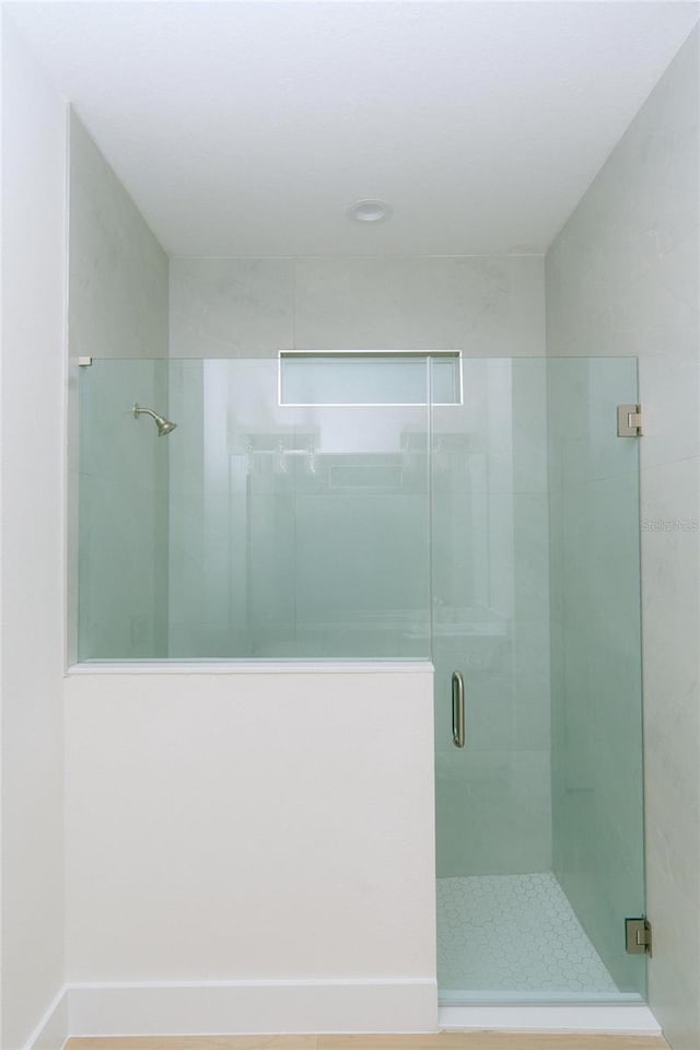 bathroom with a stall shower