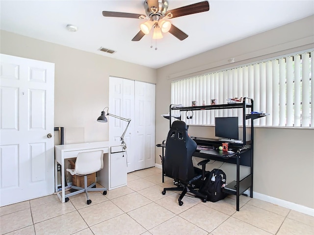 office featuring ceiling fan and light tile patterned floors