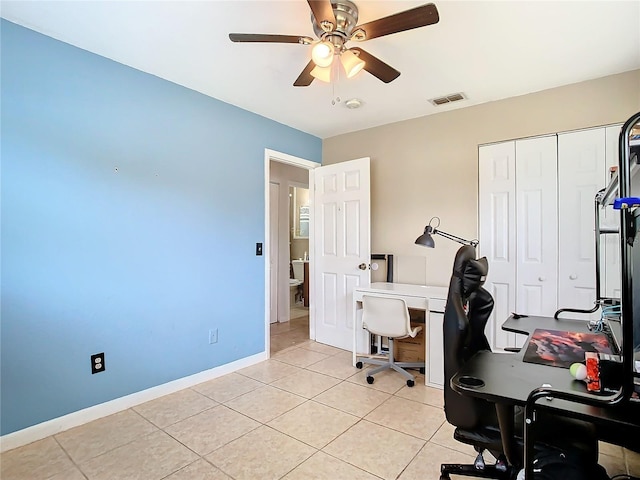 home office with light tile patterned flooring and ceiling fan