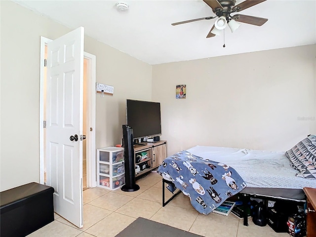 bedroom featuring light tile patterned flooring and ceiling fan