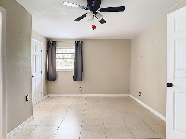 unfurnished room with light tile patterned floors and ceiling fan