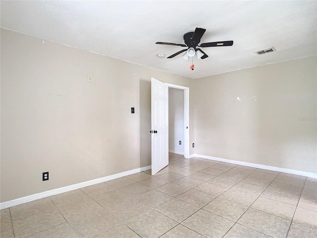 unfurnished room featuring ceiling fan and light tile patterned flooring