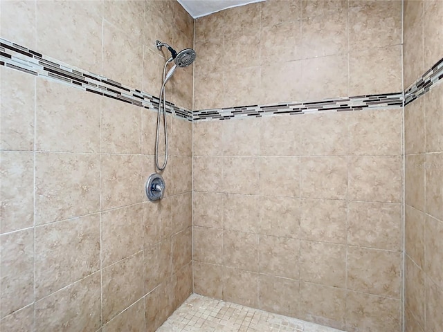 bathroom with a tile shower