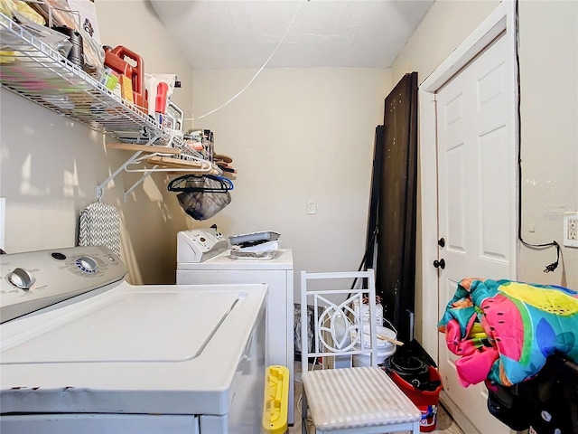 washroom featuring washer and clothes dryer