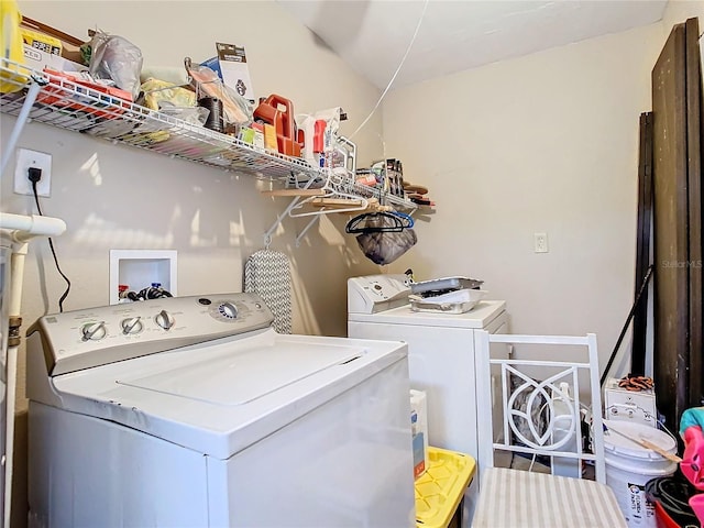 laundry room with separate washer and dryer