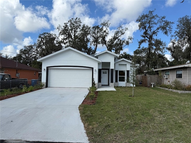 ranch-style house with a garage and a front lawn