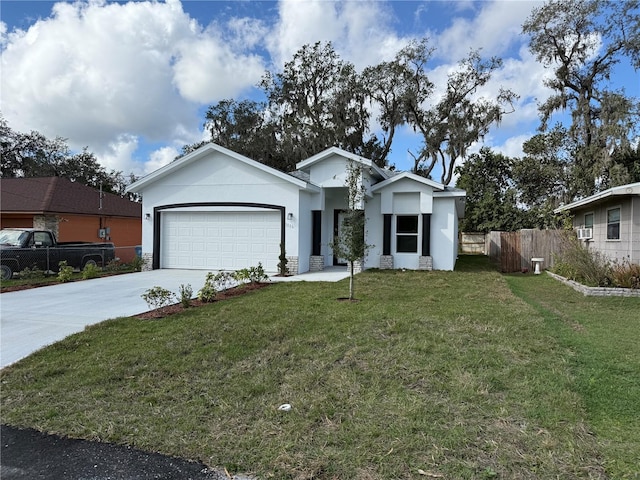 view of front of home featuring cooling unit, a garage, and a front lawn