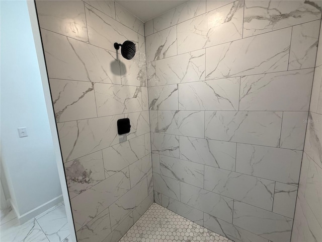 bathroom featuring tiled shower