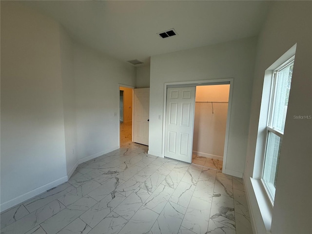 unfurnished bedroom with a closet