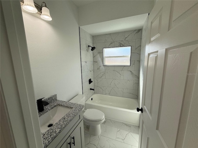 full bathroom featuring vanity, tiled shower / bath, and toilet