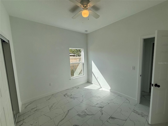 unfurnished bedroom featuring ceiling fan