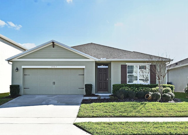 ranch-style house with a garage and a front yard