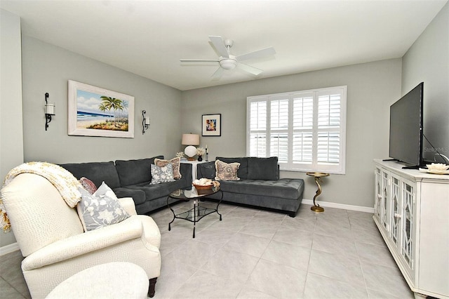 tiled living room with ceiling fan