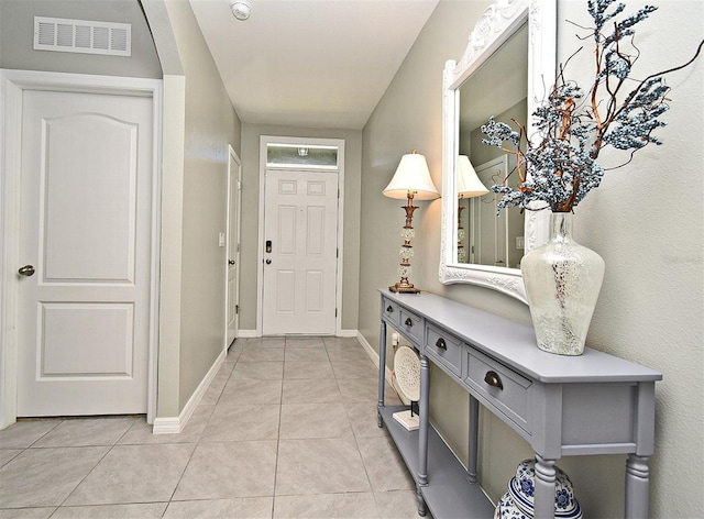 interior space with light tile patterned floors