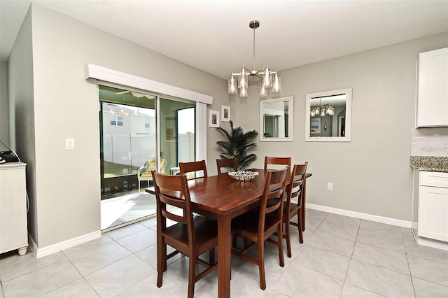 dining room with a chandelier and light tile patterned flooring