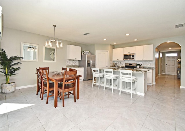 dining room with light tile patterned flooring