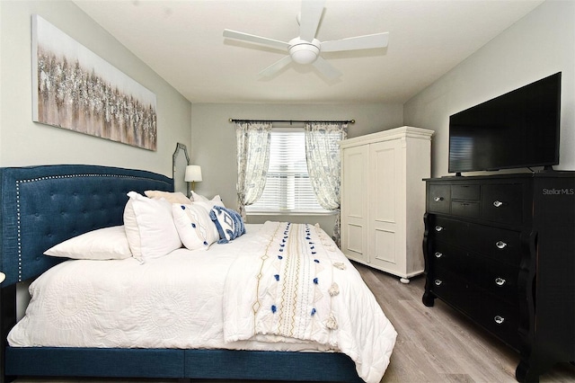 bedroom featuring ceiling fan and light hardwood / wood-style floors