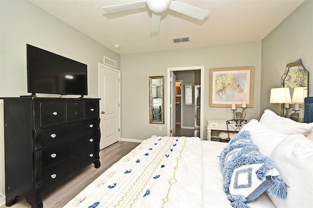 bedroom with ceiling fan and wood-type flooring