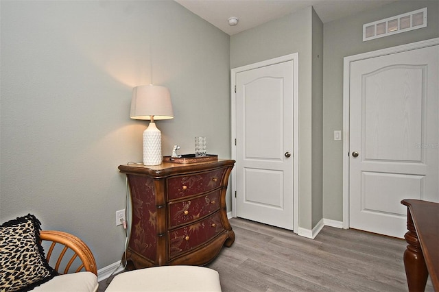 sitting room featuring hardwood / wood-style floors