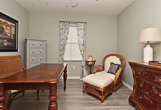 living area with hardwood / wood-style flooring