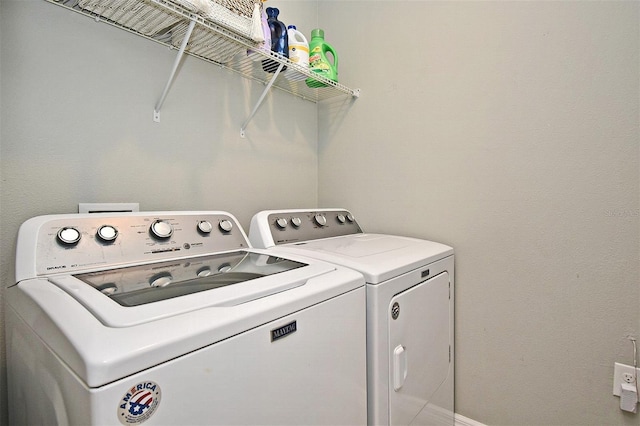 washroom with washer and dryer