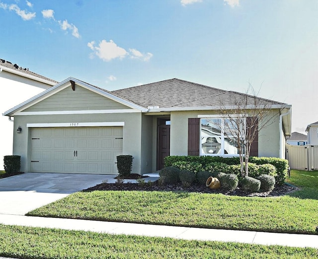 single story home with a garage and a front yard